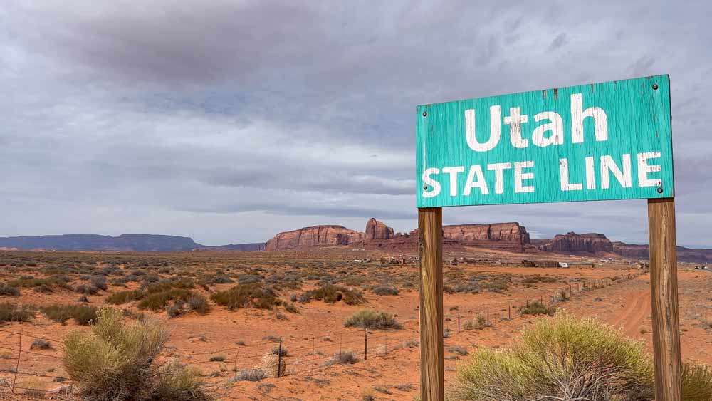 Utah State Line road sign in red desert