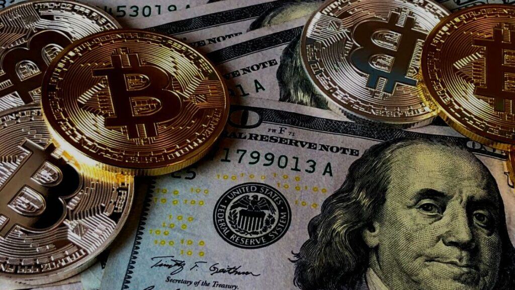 Bitcoin tokens on hundred-dollar bills