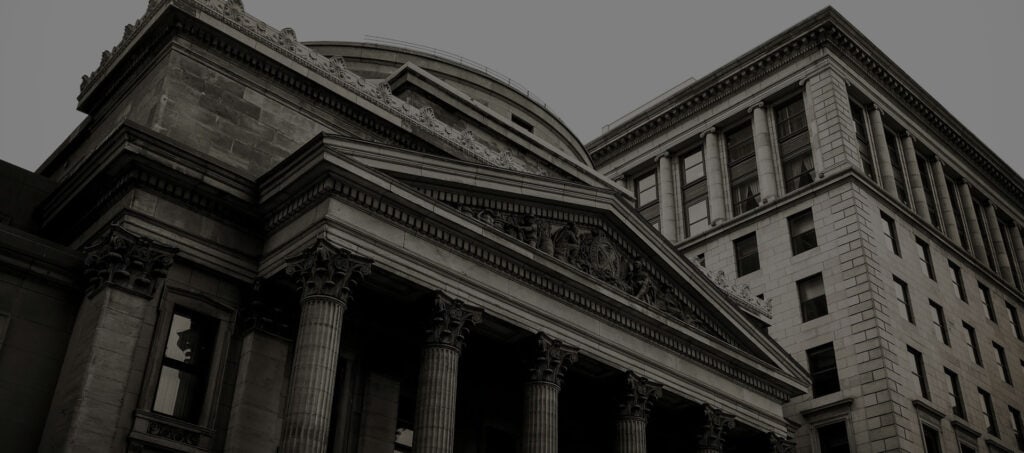 Columned stone building in black and white