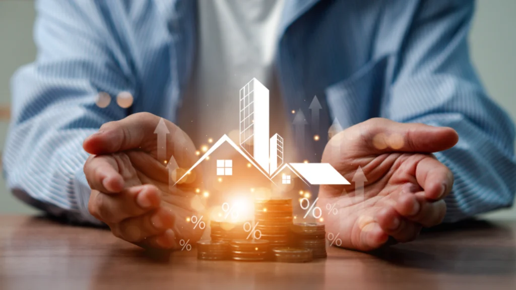 Cupped hands holding glowing model buildings