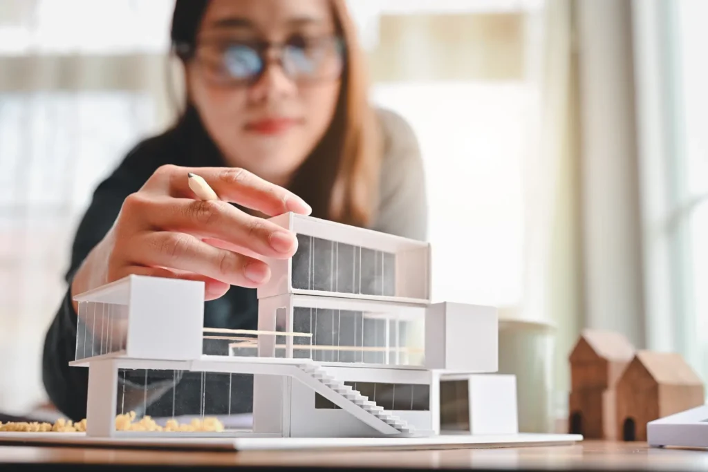 Woman working on an architectural model